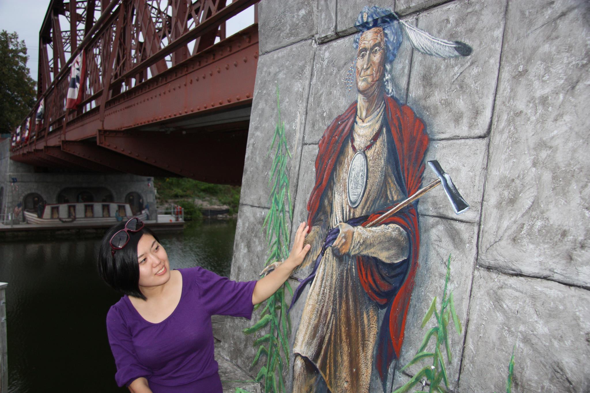 Woman with murla along Erie Canal