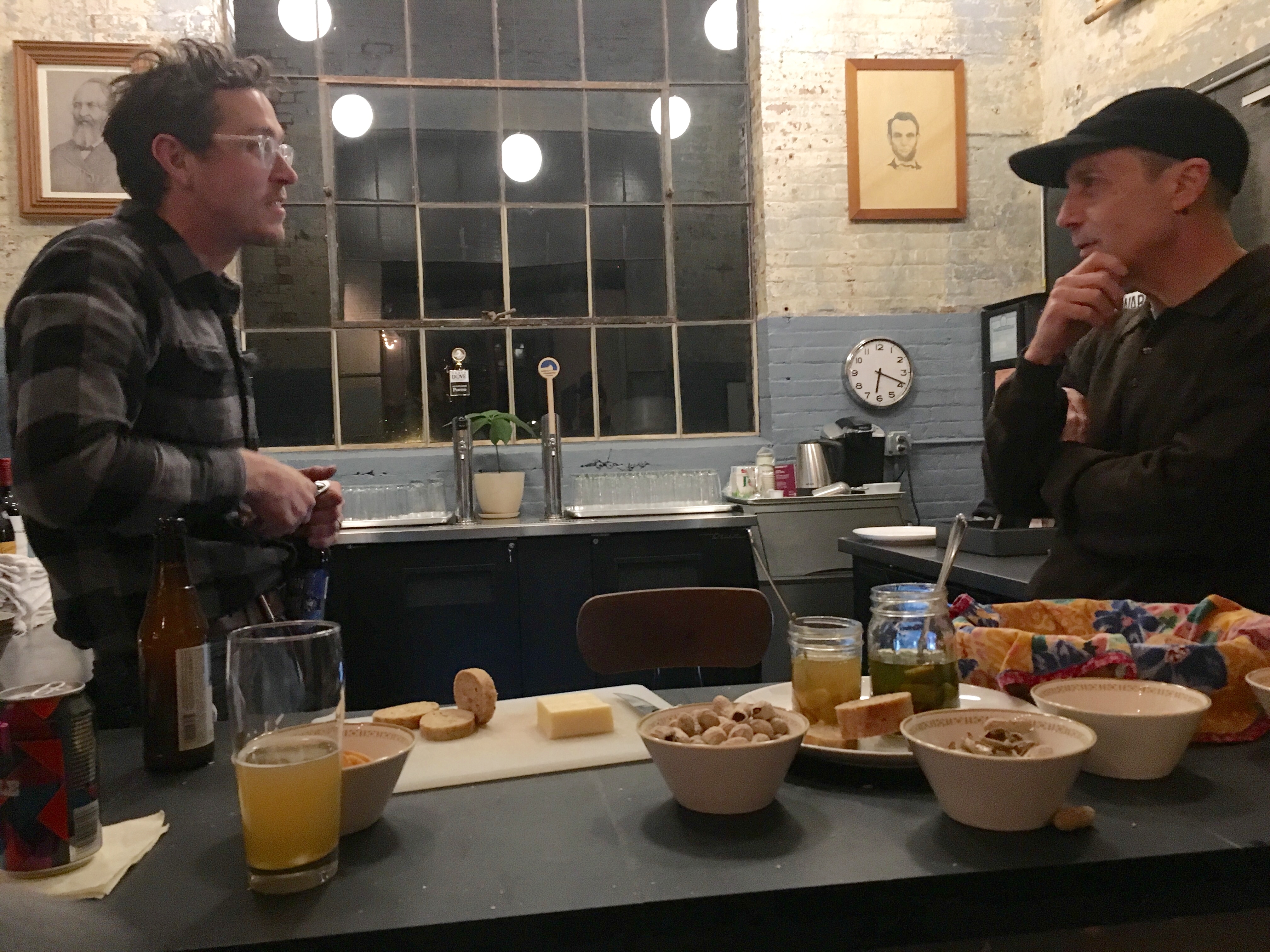 Two bartenders chatting at Cracker Factory in Geneva