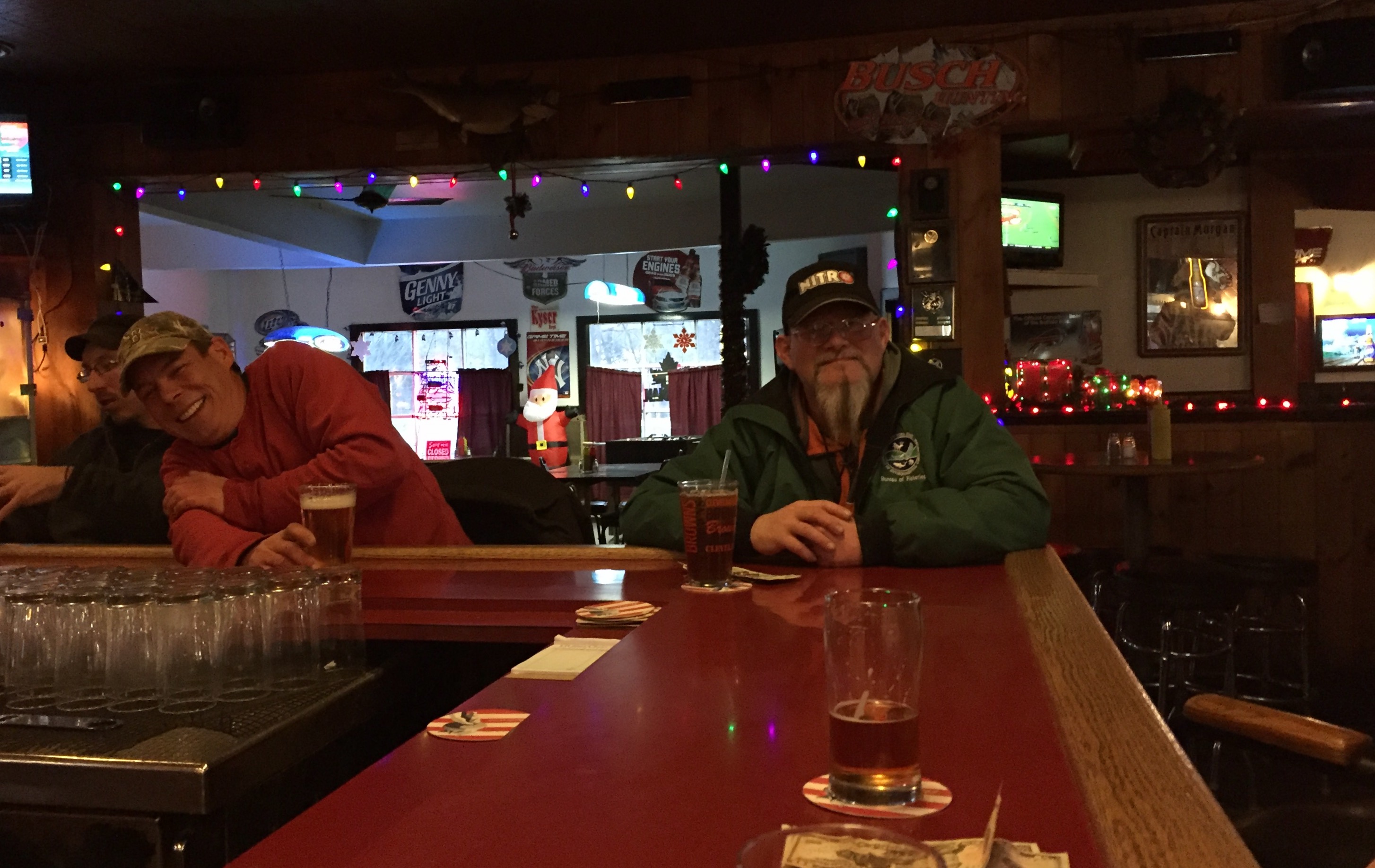 Smiling patrons enjoy a beer at the Middletown Tavern in Naples.