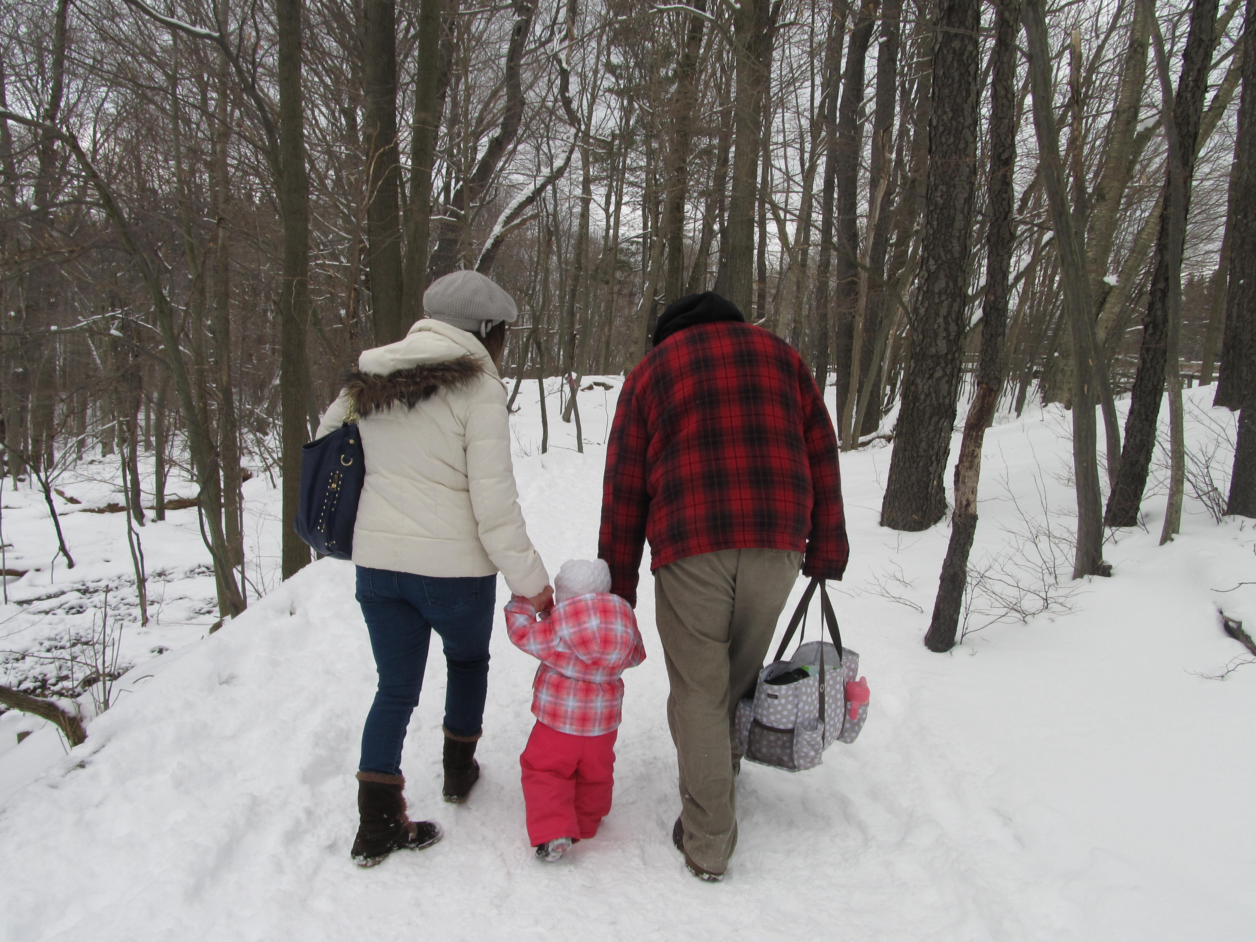 famliy walks through maple trail at Cumming Nature Center in the Finger Lakes