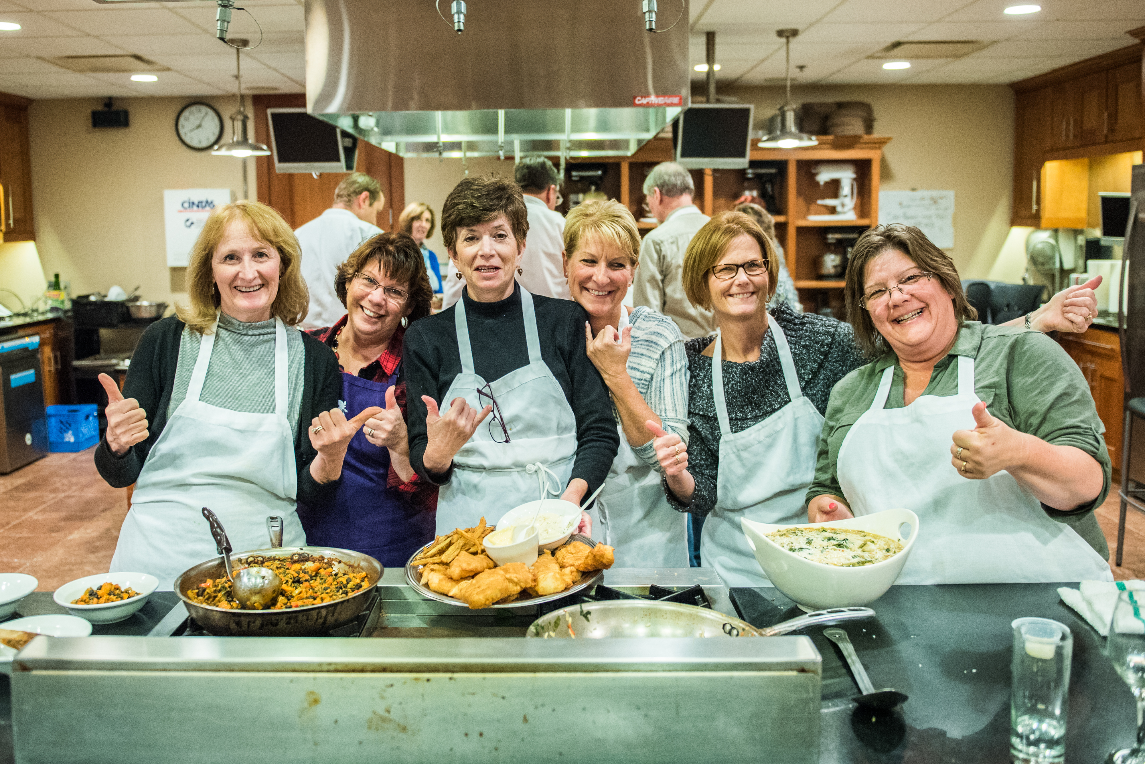 Celebrating a well cooked meal in the hands-on kitchen at the New York Wine & Culinary Center