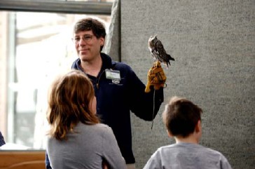 One of The Wild Center’s owls, shown here with head curator David Gross, is one example of the Center’s new Mother of Invention theme for 2009. Researchers are working to understand the qualities of owl’s wings to make quieter and more efficient fan blades.
