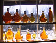 Maple syrup bottles in the window at Uihlein Maple Forest, Lake Placid