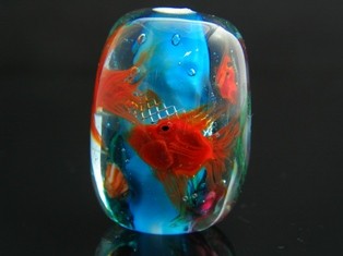 Congdon’s unique aquarium glass bead, “Three Amigos,” is one of over fifty beads presented in the exhibit.