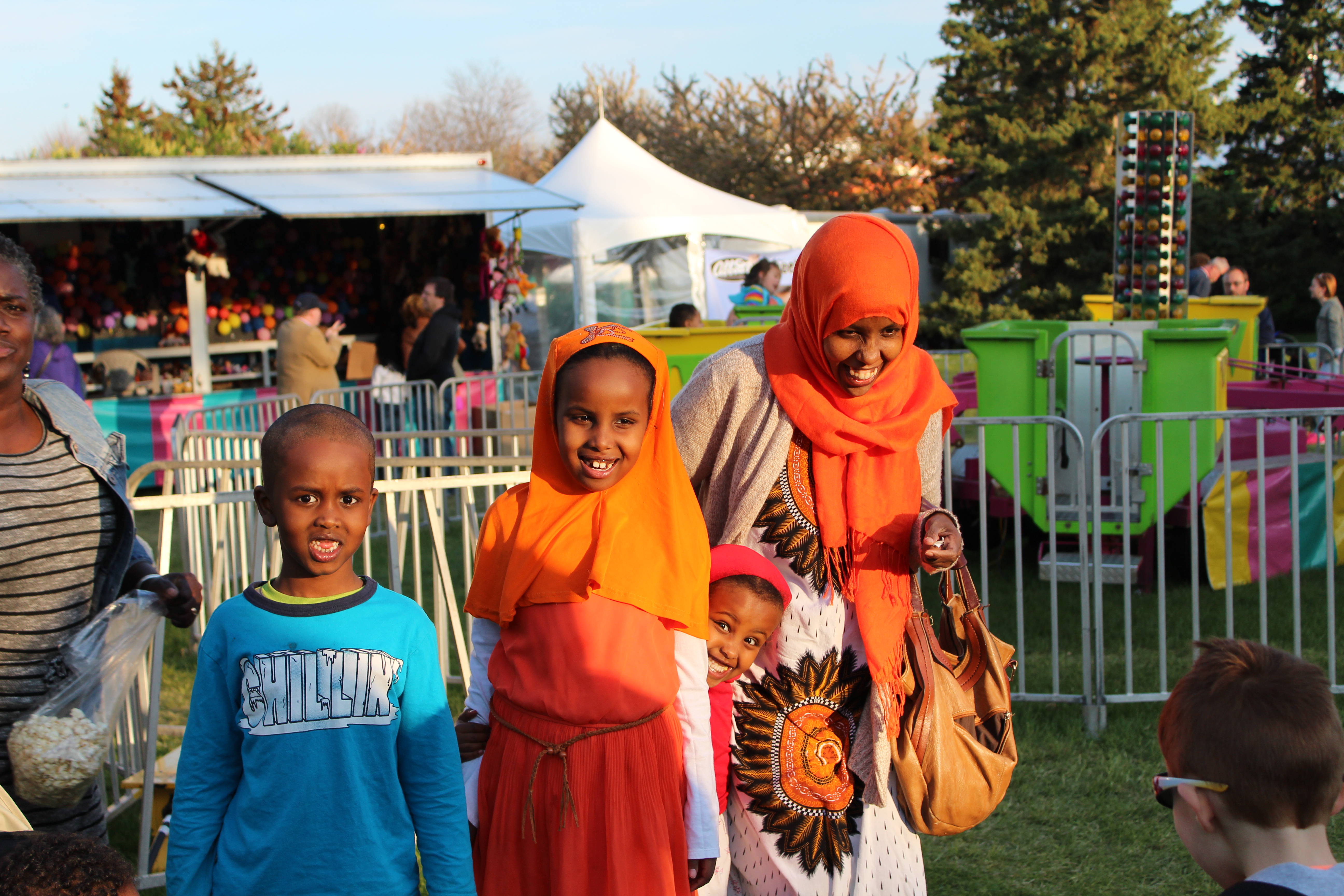 A family enjoys the fun rides and attractions at the Rochester Lilac Festival