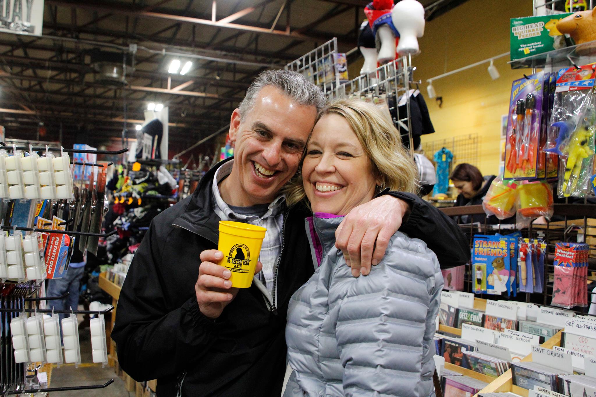 couple smiles with while celebrationg Record Store Day at Record Archive in Rochester, NY