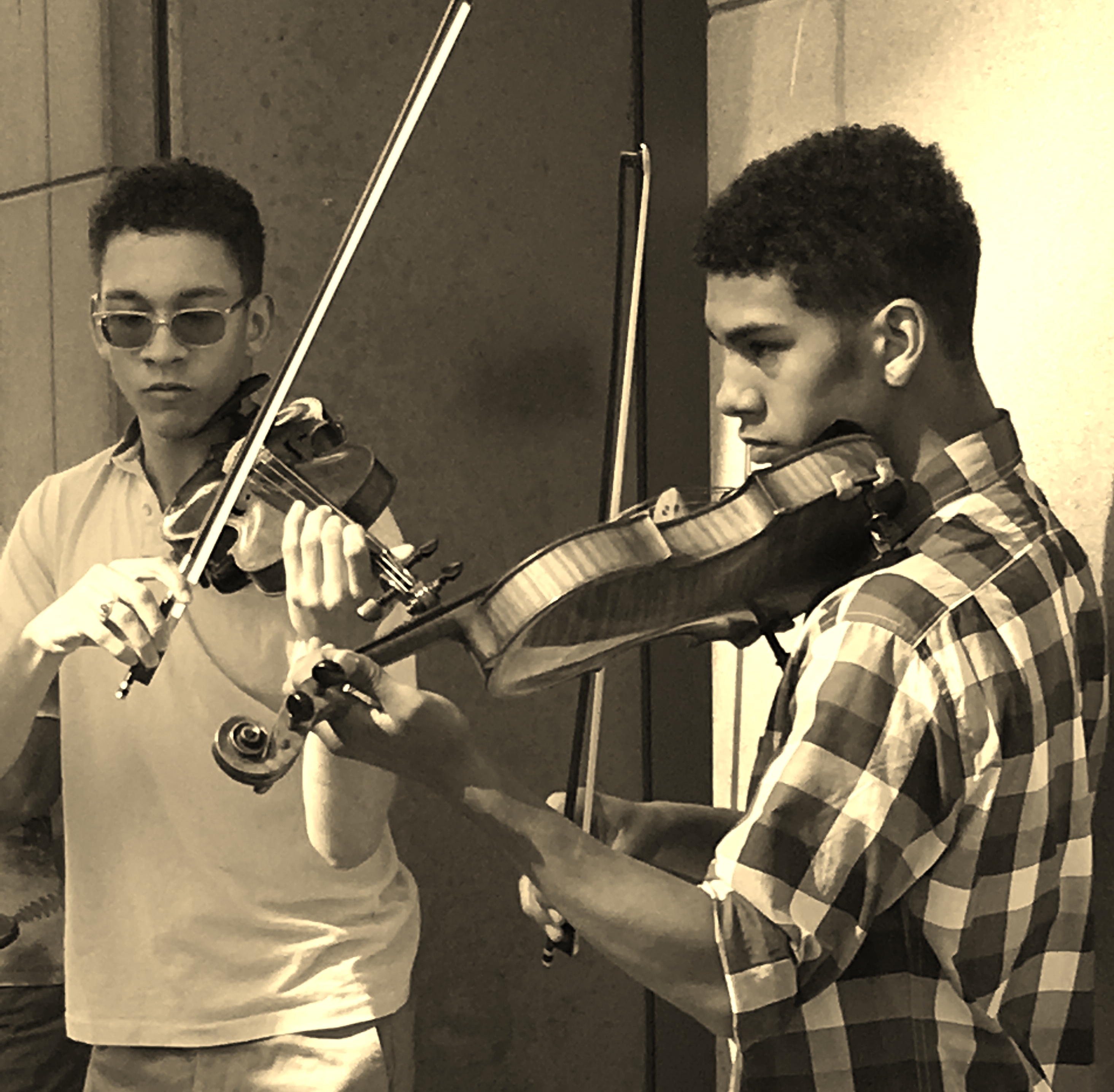 Two young men play their violins at Bunkerfest 2017.