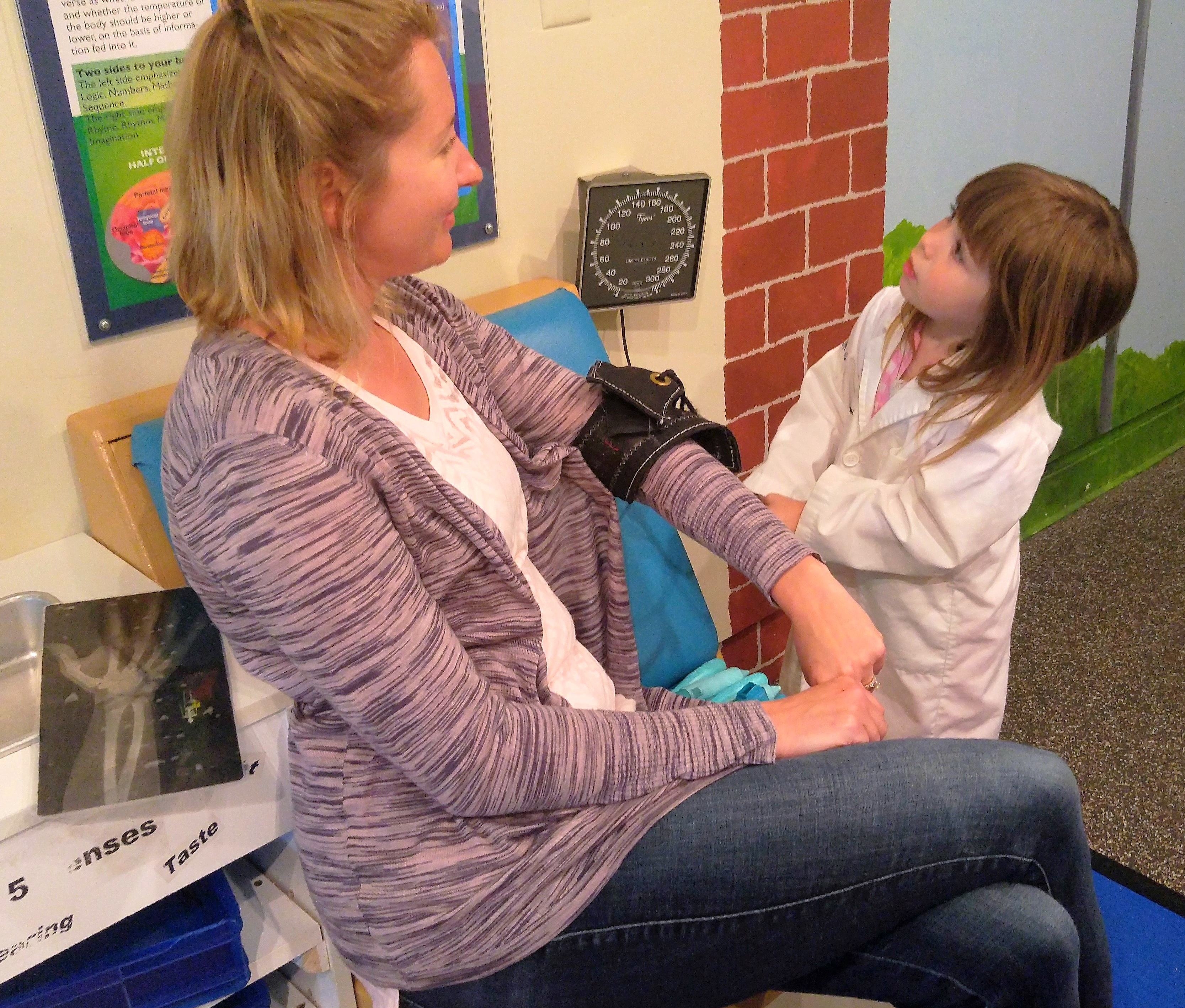 Child "taking patient's blood pressure" in Bucks County Children's Museum