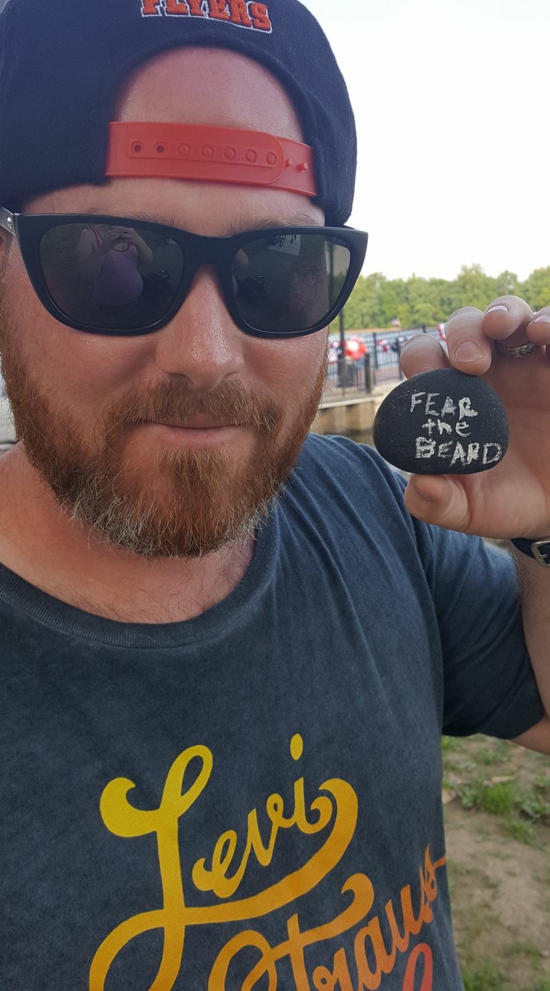 Man with painted rock in Bristol