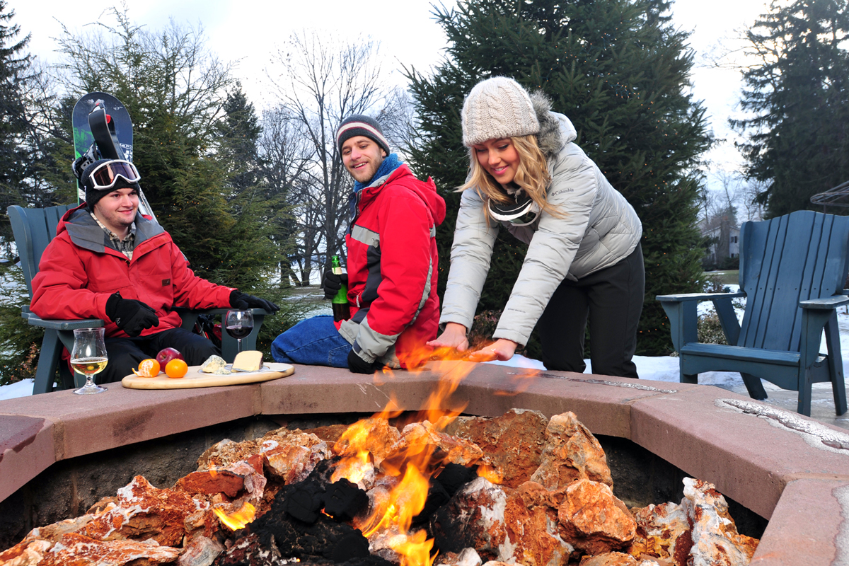 belhurst-geneva-vasiliy-winter-exterior-firepit-warming-hands