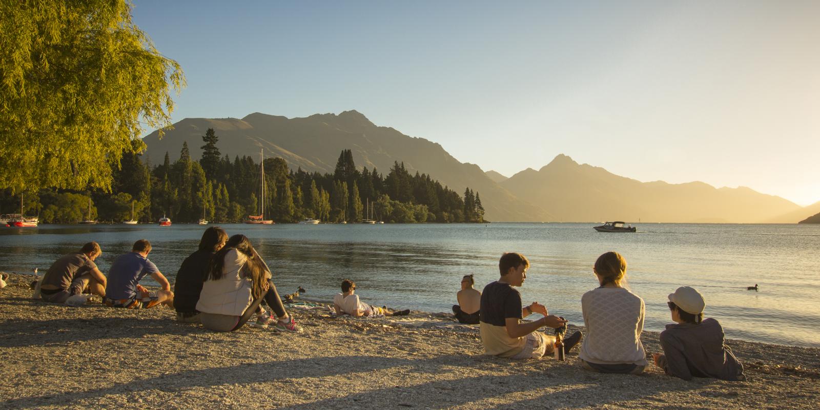 Watching the sunset on Queenstown Bay in summer Watching the sunset on Queenstown Bay