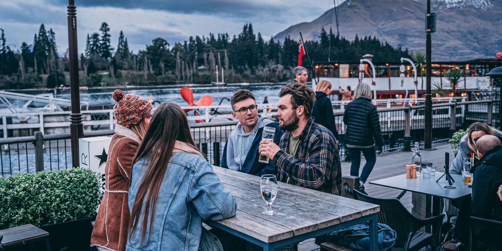 Après ski with friends on Steamer Wharf, Queenstown Après ski with friends on Steamer Wharf, Queenstown