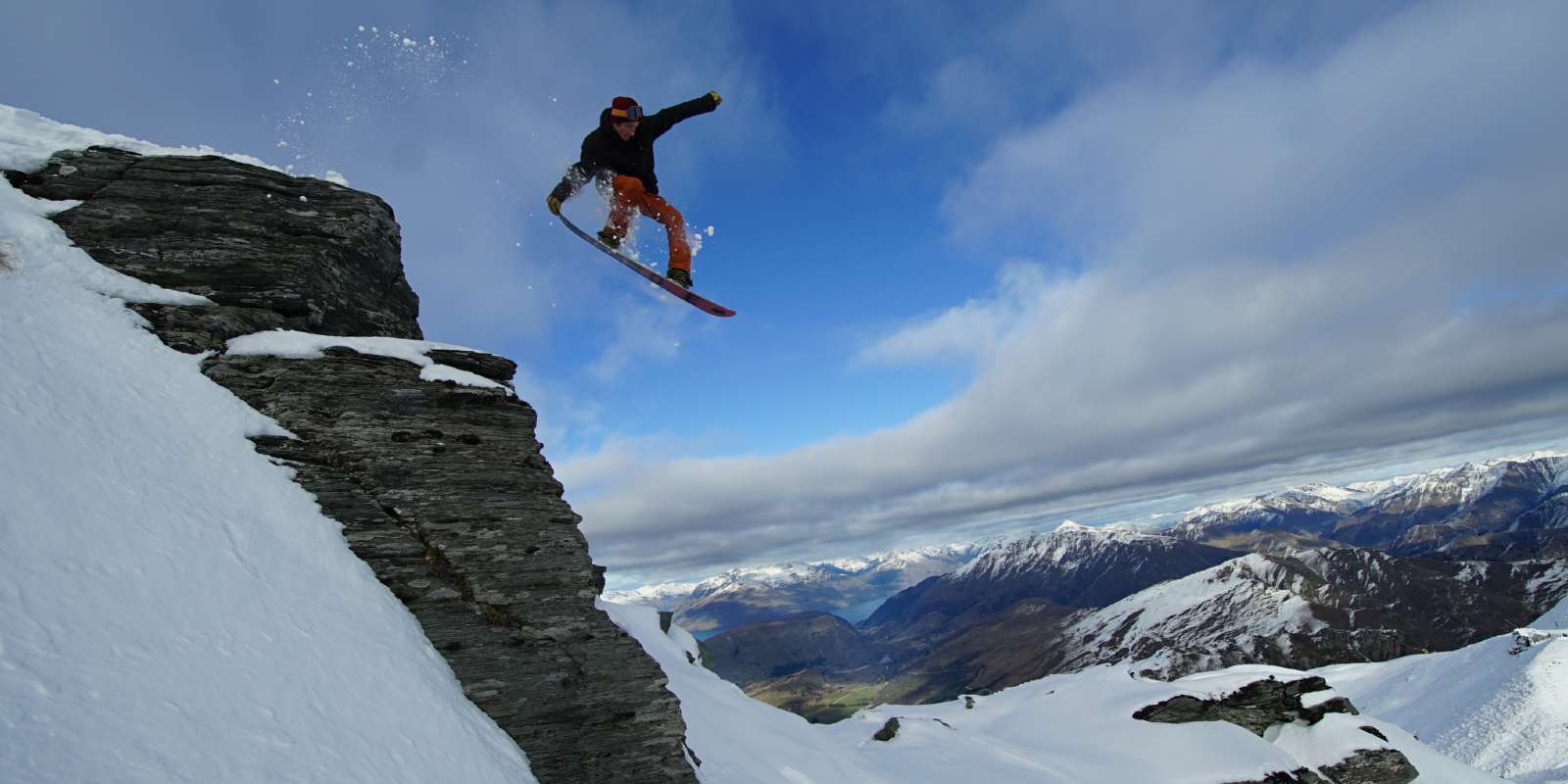 Snowboarder getting air at Coronet Peak Coronet Peak