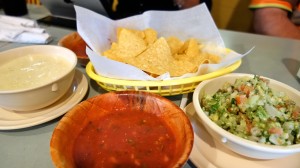 Chunky guacamole, queso sauce, salsa, and chips