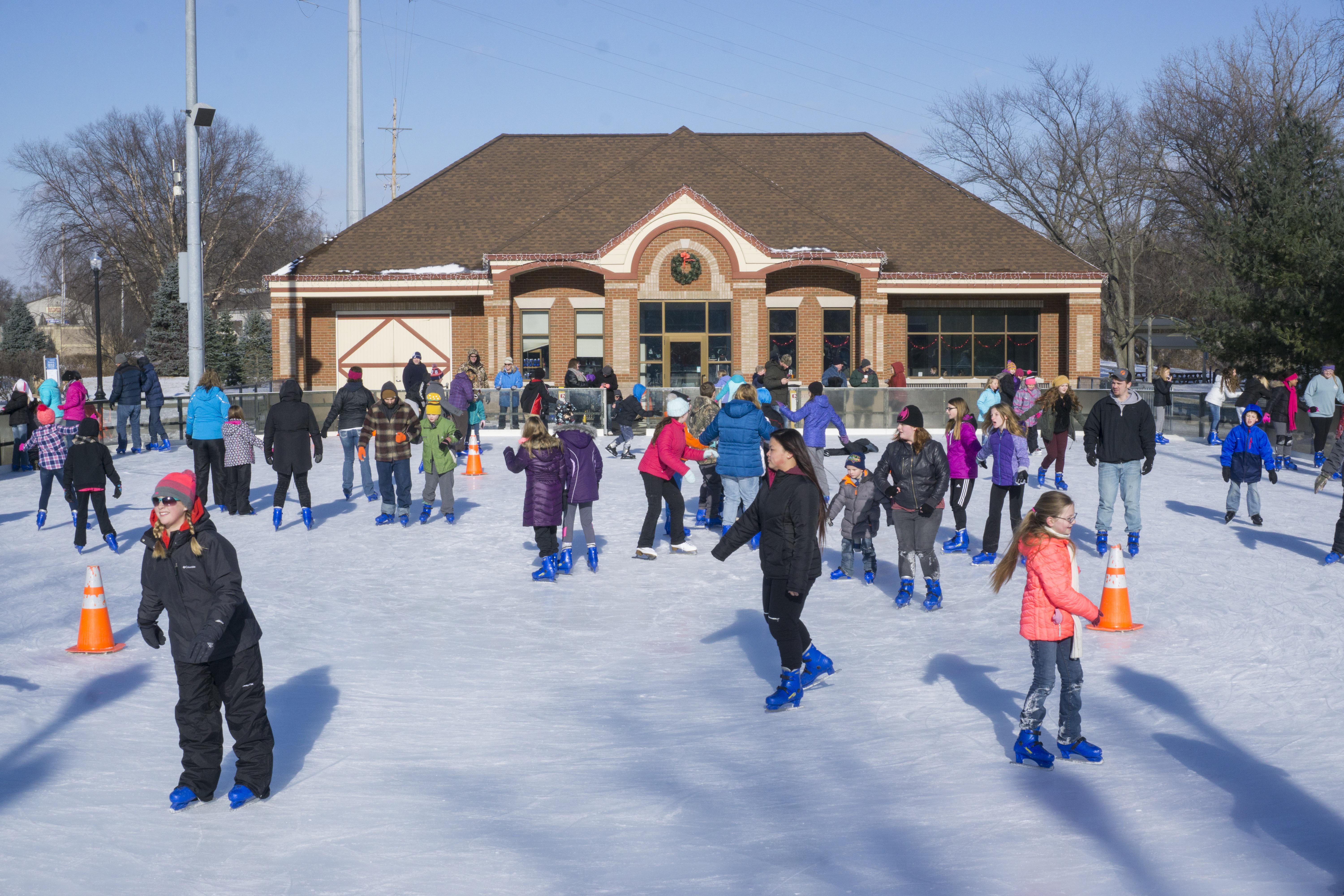 Could you ice skate in a swim suit? These skaters have the right of it wearing full outdoor winter gear!