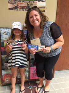 Amy and her daughter receiving their prize!