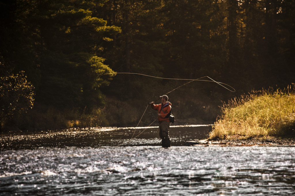 Fall fly fishing for trout along the Escanaba River in Michigan's Upper Peninsula.