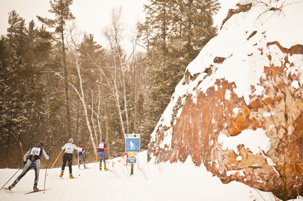 Skiers compete in the Noquemanon Ski Marathon cross country Nordic ski race from Ishpeming to Marquette Michigan.