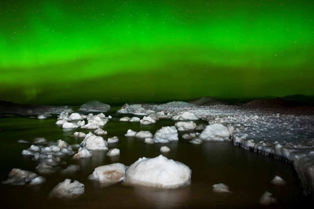 Northern Lights aurora borealis over Lake Superior at Au Train Michigan in Michigan's Upper Peninsula in winter.