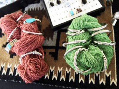 Holiday reds and greens in handspun, hand-dyed yarns make a colorful backdrop for beautiful turquoise jewelry.