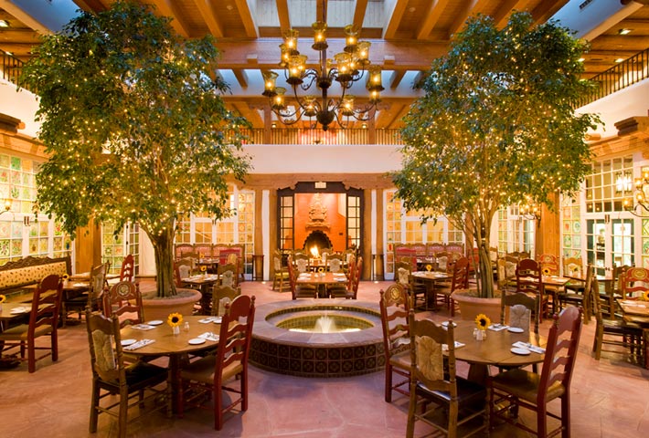 A perennial favorite among Santa Fe visitors, guests at La Plazuela bask in the natural light of its original 1920s-era patio.