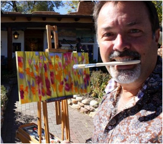 Marshall Noice of Waxlander Gallery gets his teeth into the art experience on Canyon Road! (Photo Credit: visitcanyonroad.com)