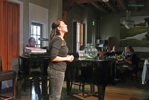 A server belts out a Broadway tune. 