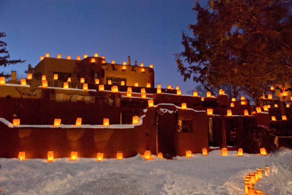 Farolitos adorn adobe walls on the eastside of Santa Fe. Photo courtesy of Jack Parsons 