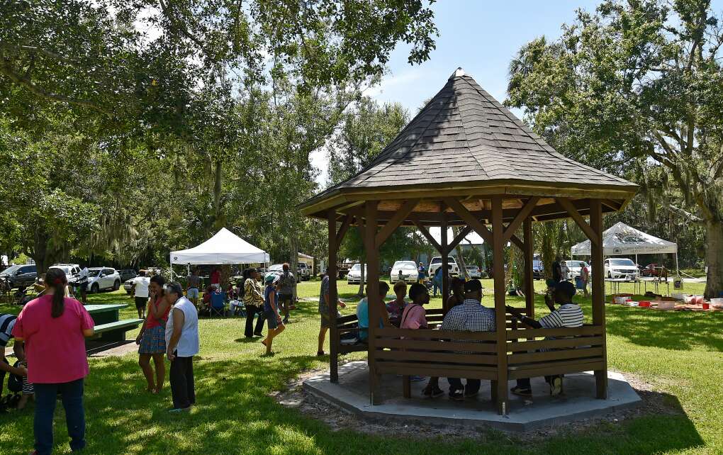 a scene from the Return to Angola festival in Mineral Springs Park in Bradenton, people in a gazebo