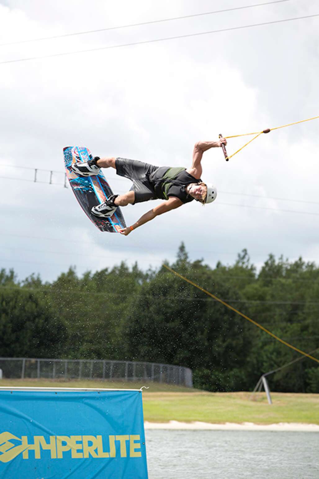A wakeboarder soars off of a jump at the Orlando WaterSports Complex where water sports fans can learn to ski or hone their skills.