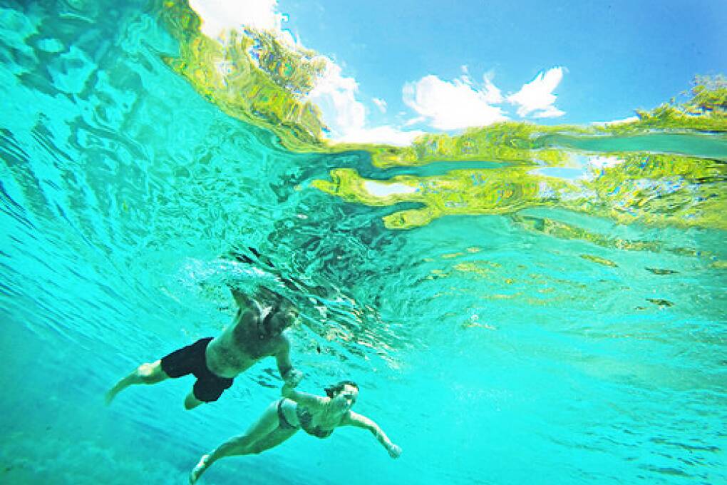 Ichetucknee Springs State Park, Fl. -- Charlie and Dorothee Walters, of South Caraolina, swim in the head waters of Ichetucknee Springs -- The State Park is just off US 27 north west of High Springs, Florida. Photo by Peter W. Cross