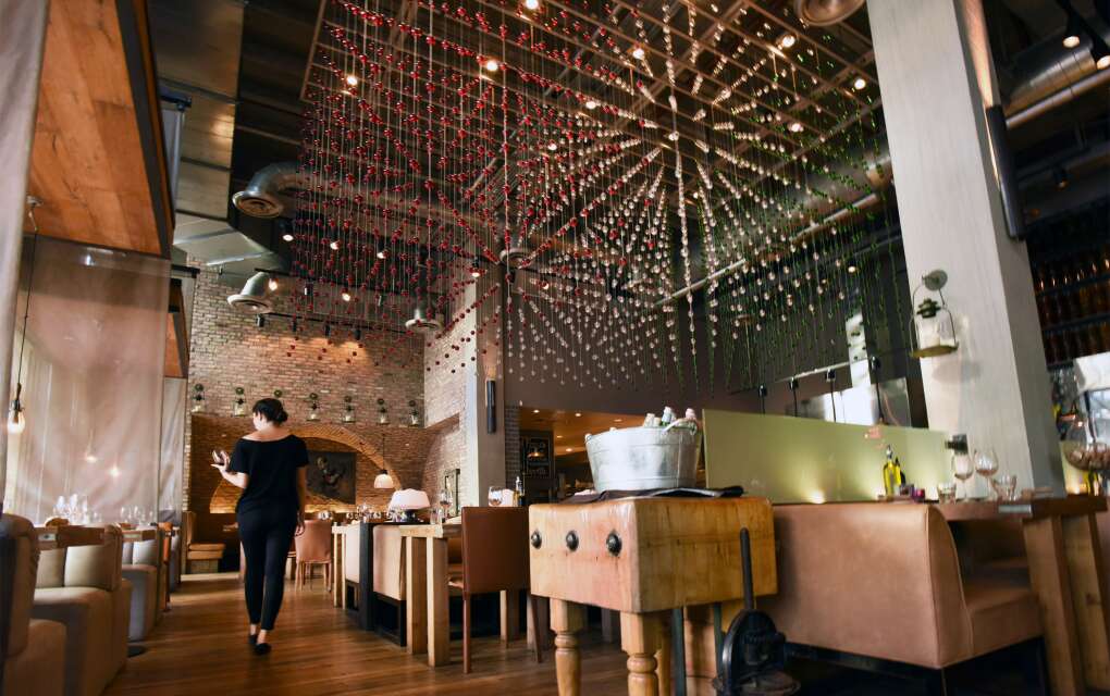 Cibo's Miami Beach flagship boasts an intricate, yet delicate design of transparent glass globes dangling from the ceiling like multicolored raindrops. 