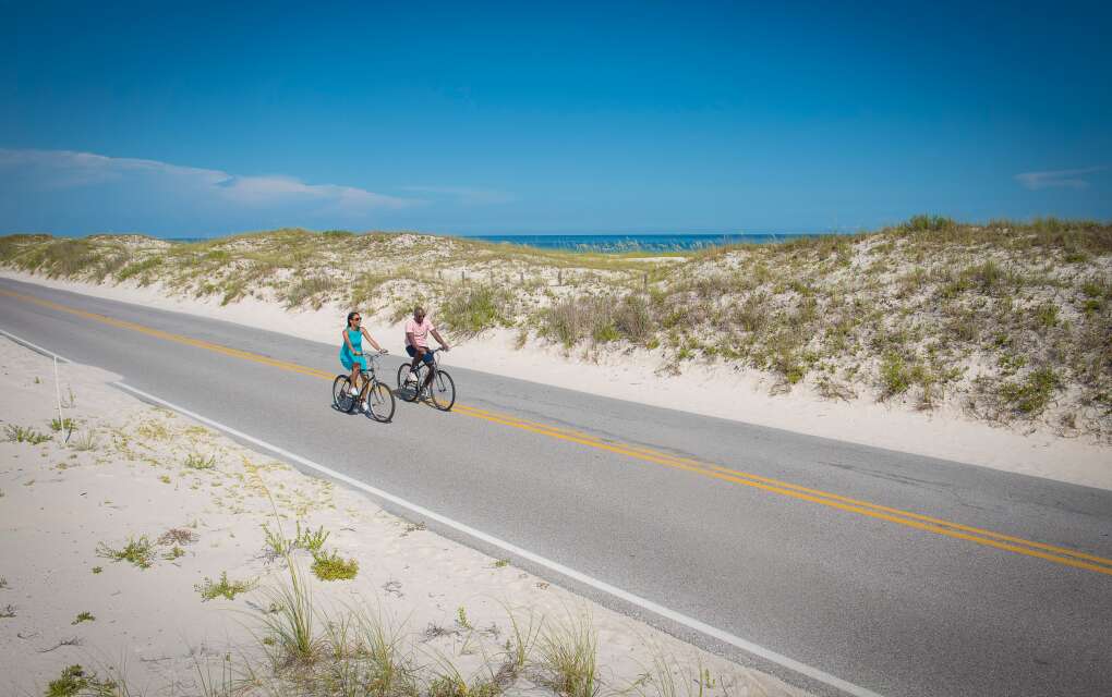 Couple Riding Bikes in Perdido Key