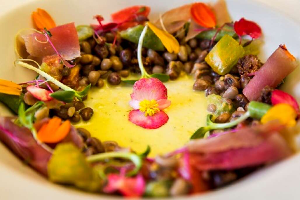 The Miccosukee Root Cellar serves its heirloom cow pea salad has green pole beans, tomatoes, blue corn hominy, cornbread croutons and jalapeño-honey vinaigrette.