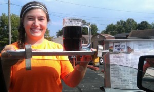 A car hop at B-K Drive-In in Huntington serves your order at your vehicle with a smile.