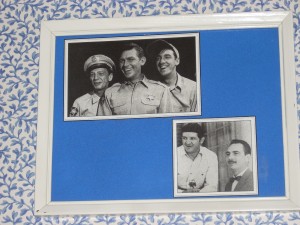 Choose your favorite cast member from photos on café walls.