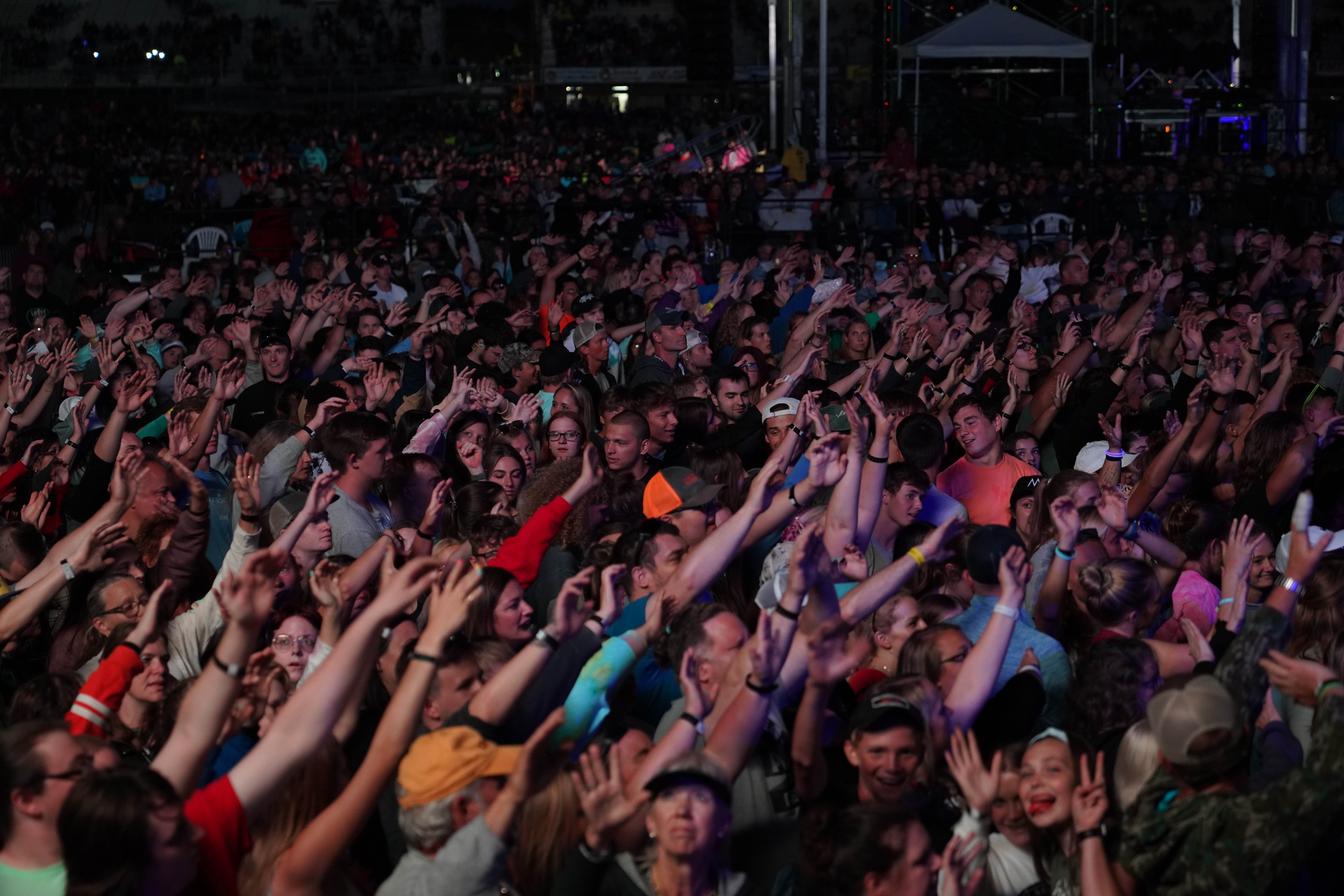 A vibrant music festival crowd enjoying performances in 1996