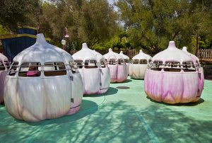 Garlic Twirl ride at Gilroy Gardens with trees behind it