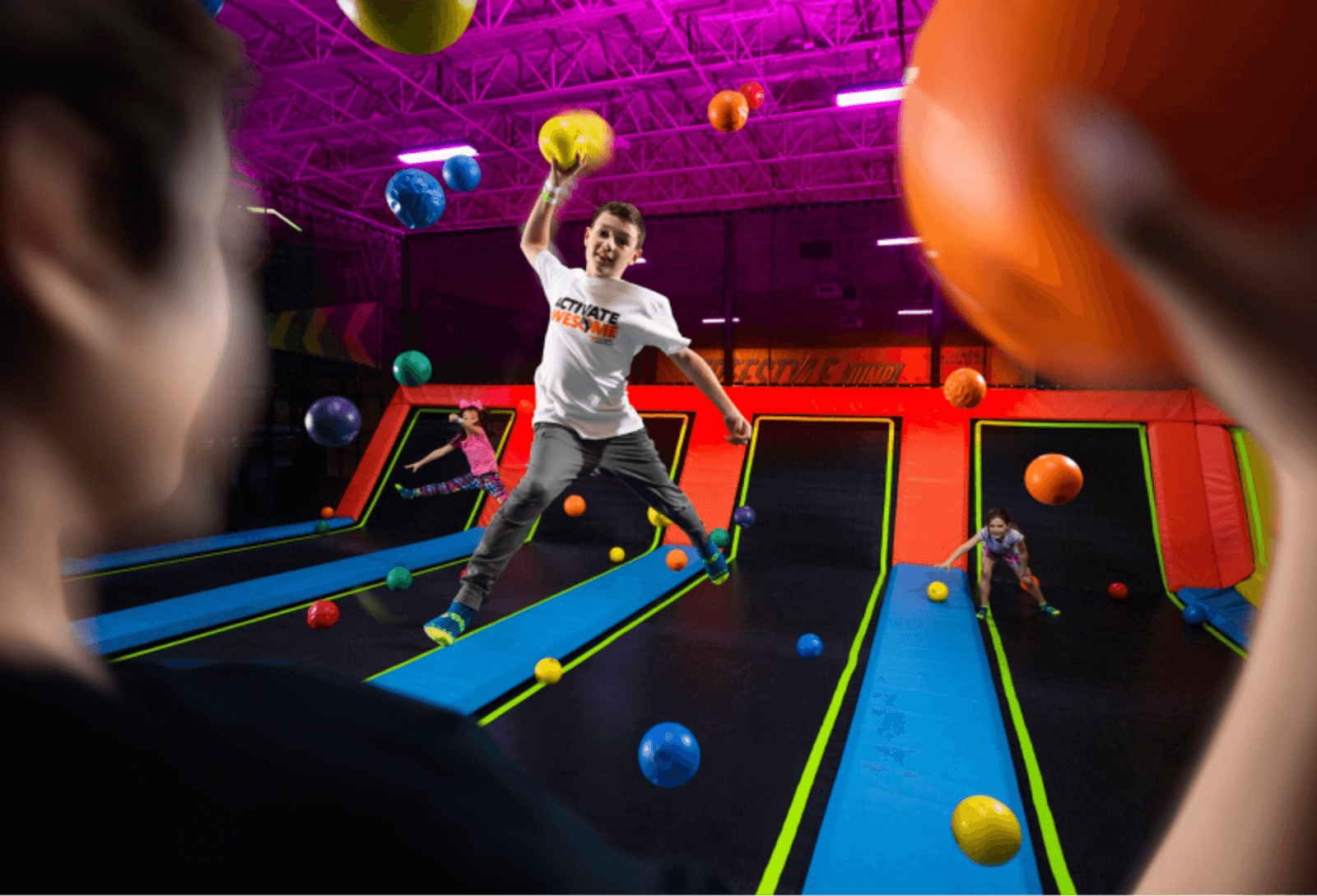 Kid playing Skee Ball at Urban Air Trampoline and Adventure Park in Denison, TX