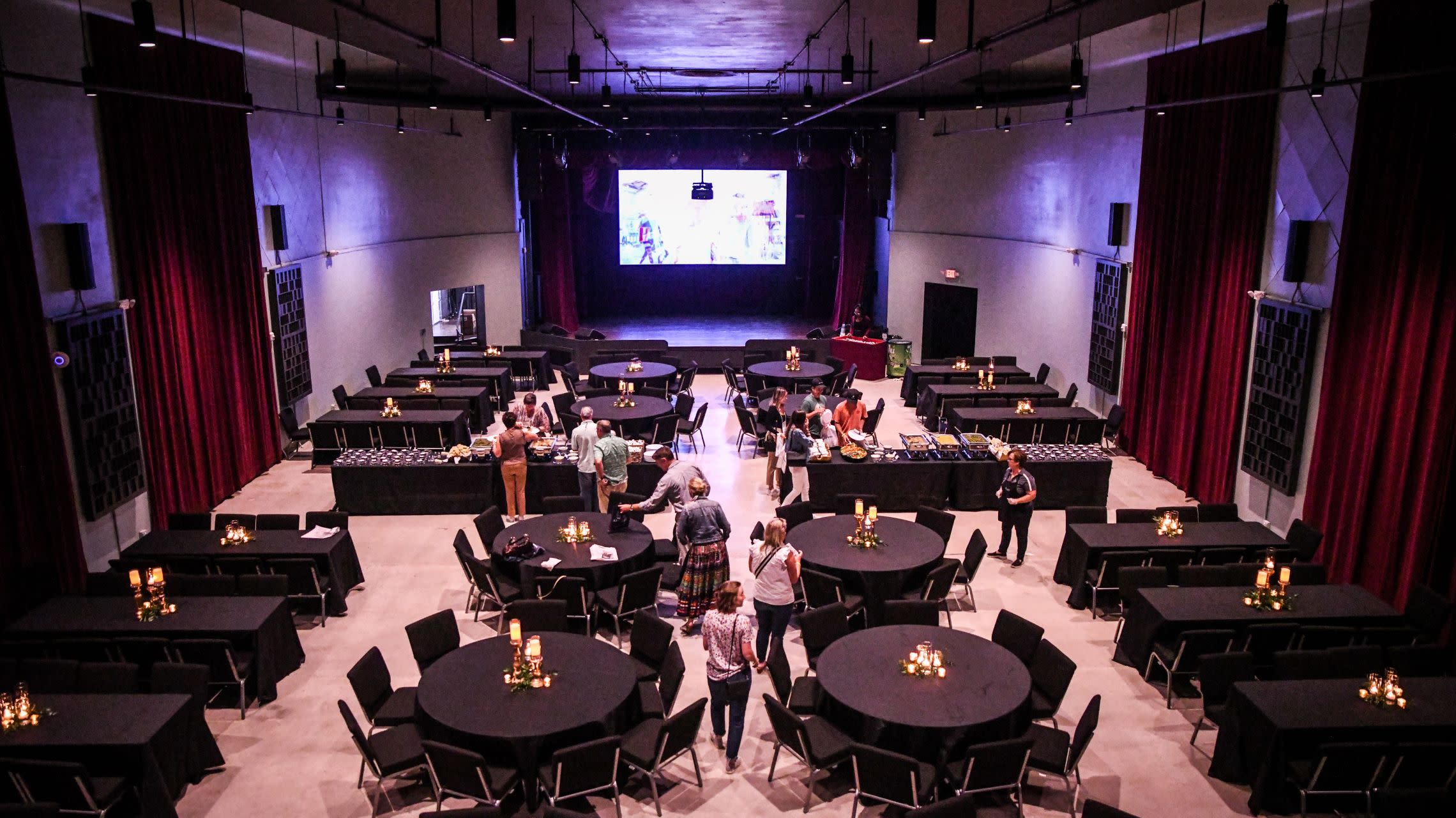 event attendees enter theater for meal