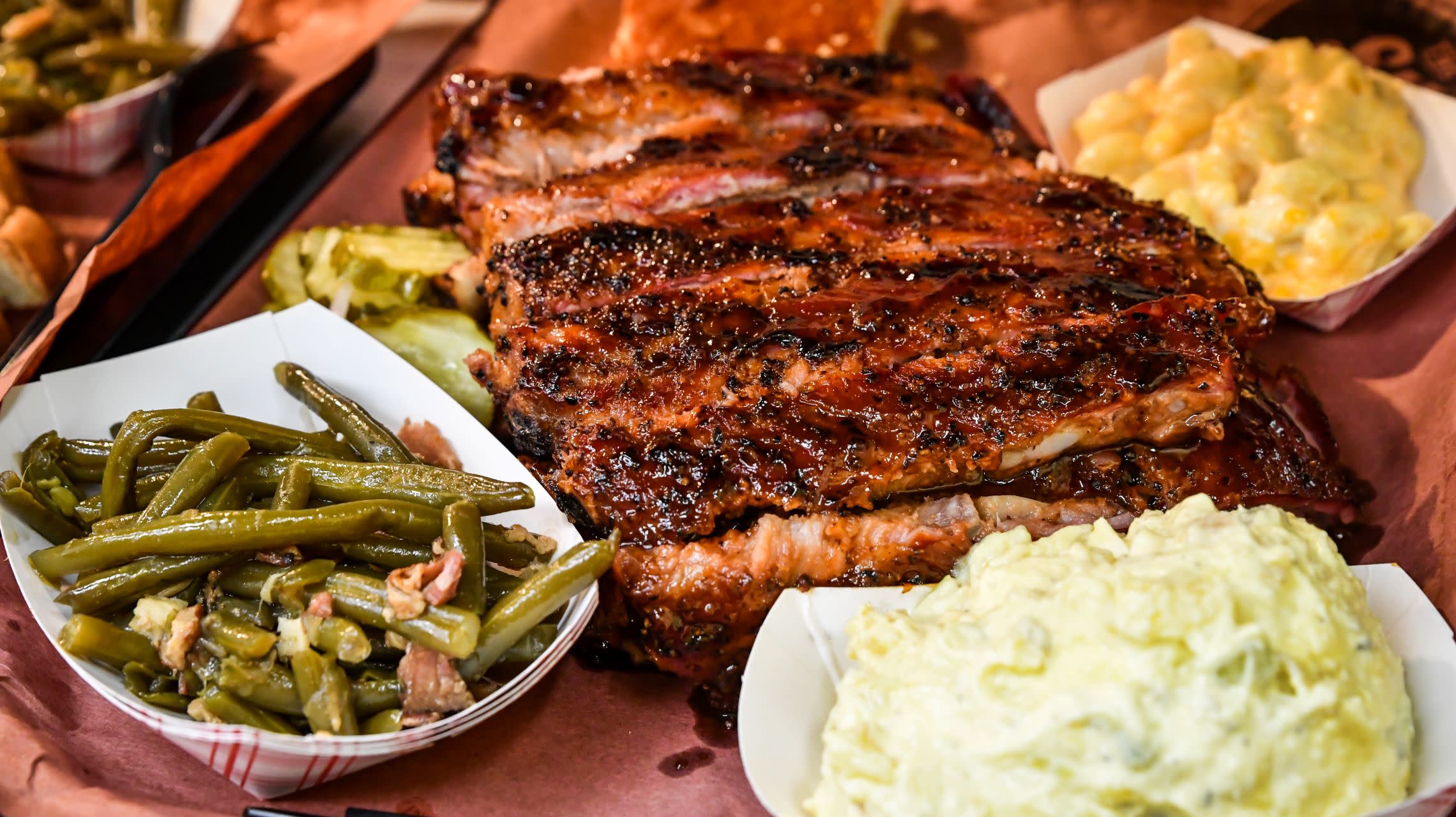 tray of barbecue ribs with sides