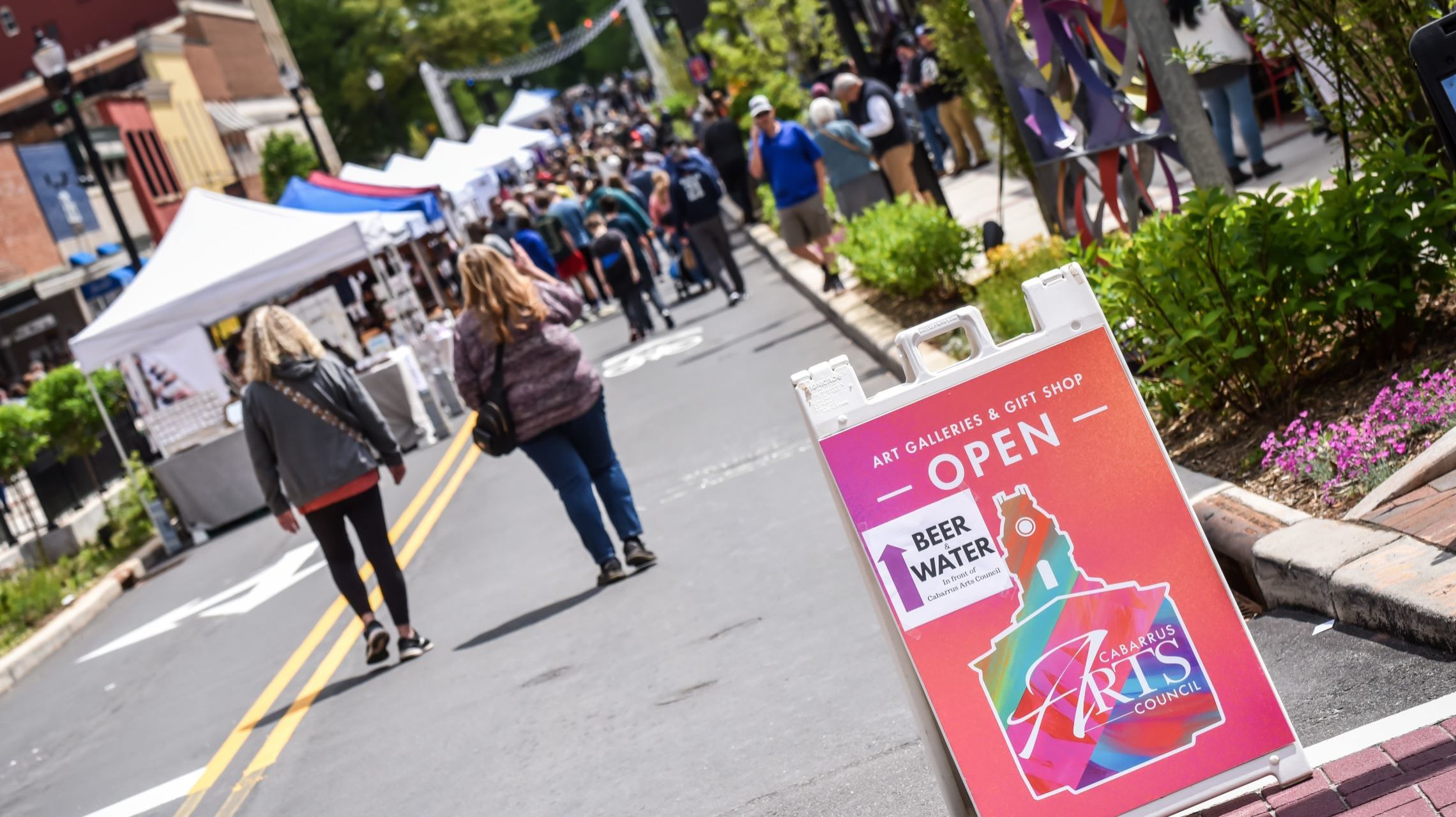 sign welcomes guests to downtown Art Walk event