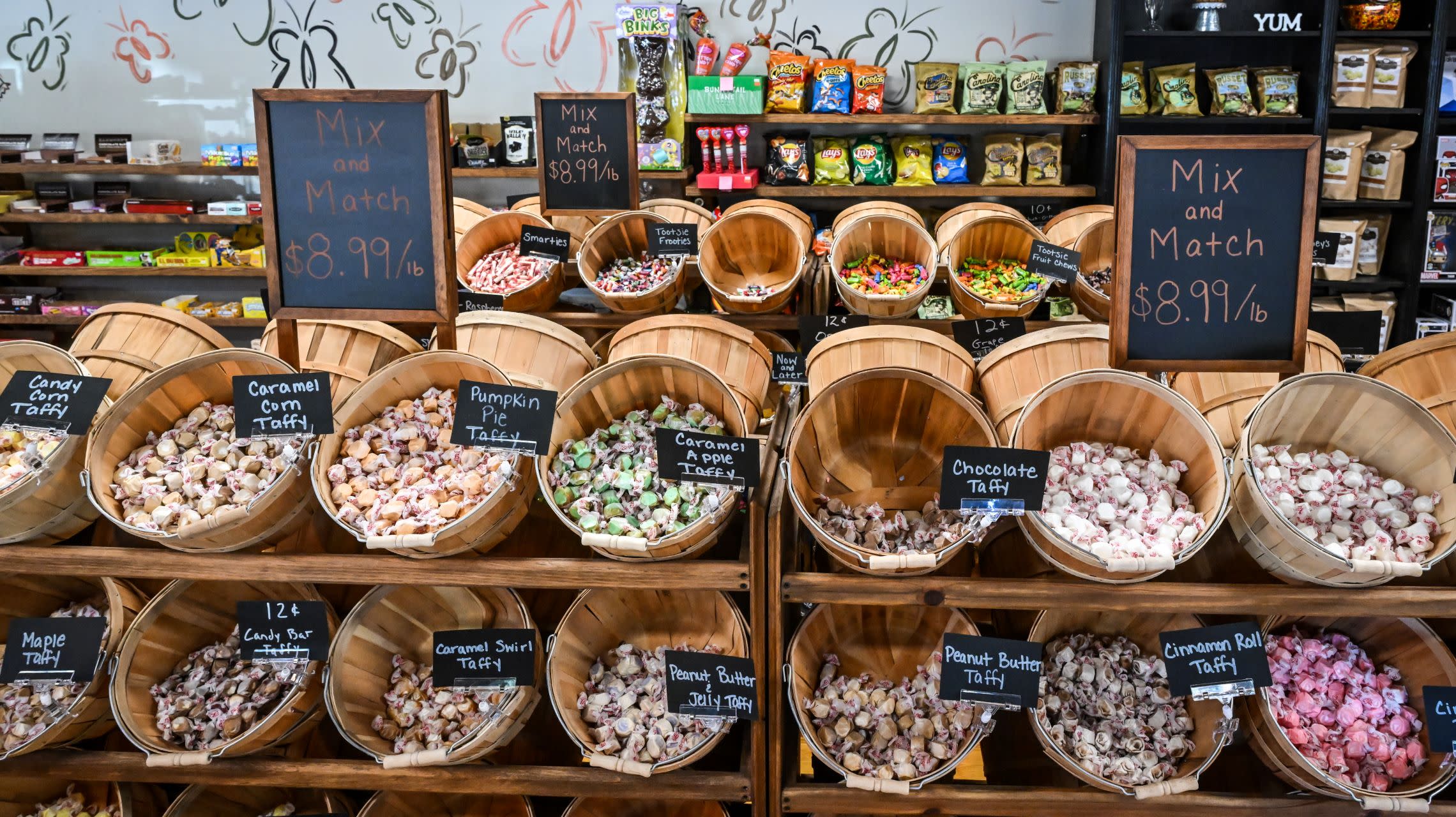 rows of buckets filled with bulk candy