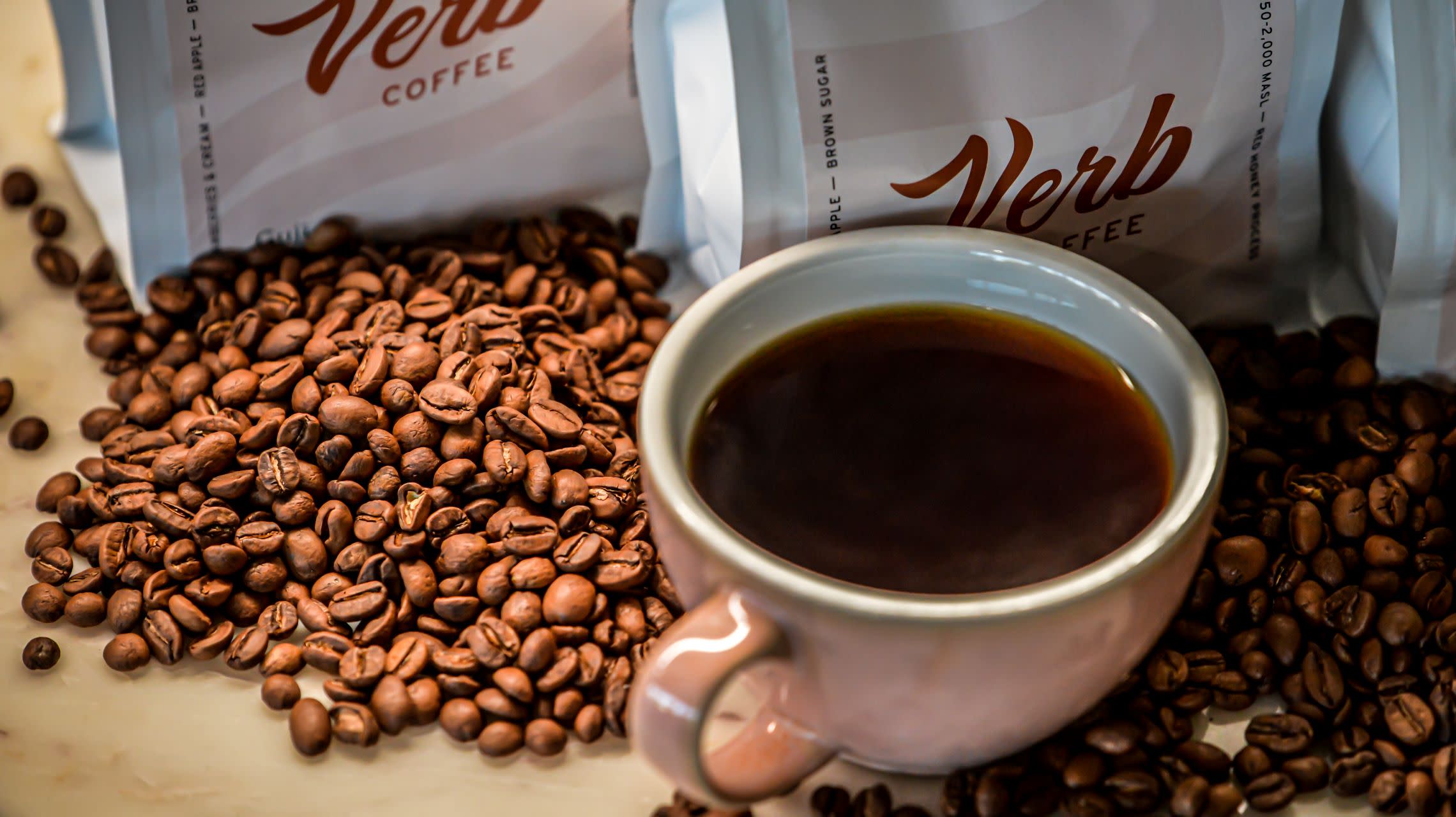 coffee beans with cup and bag of coffee