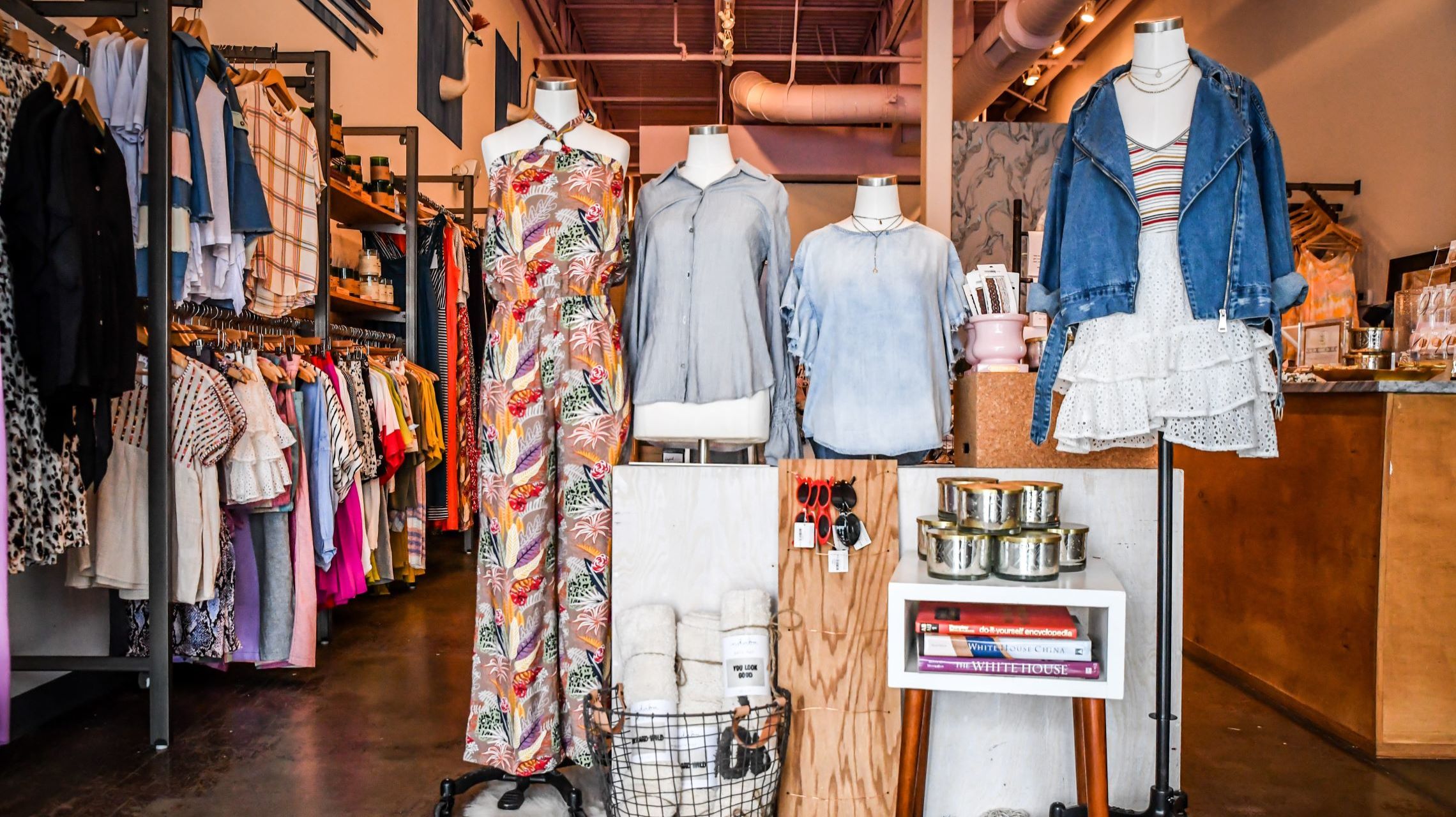 mannequins display trending clothing inside boutique