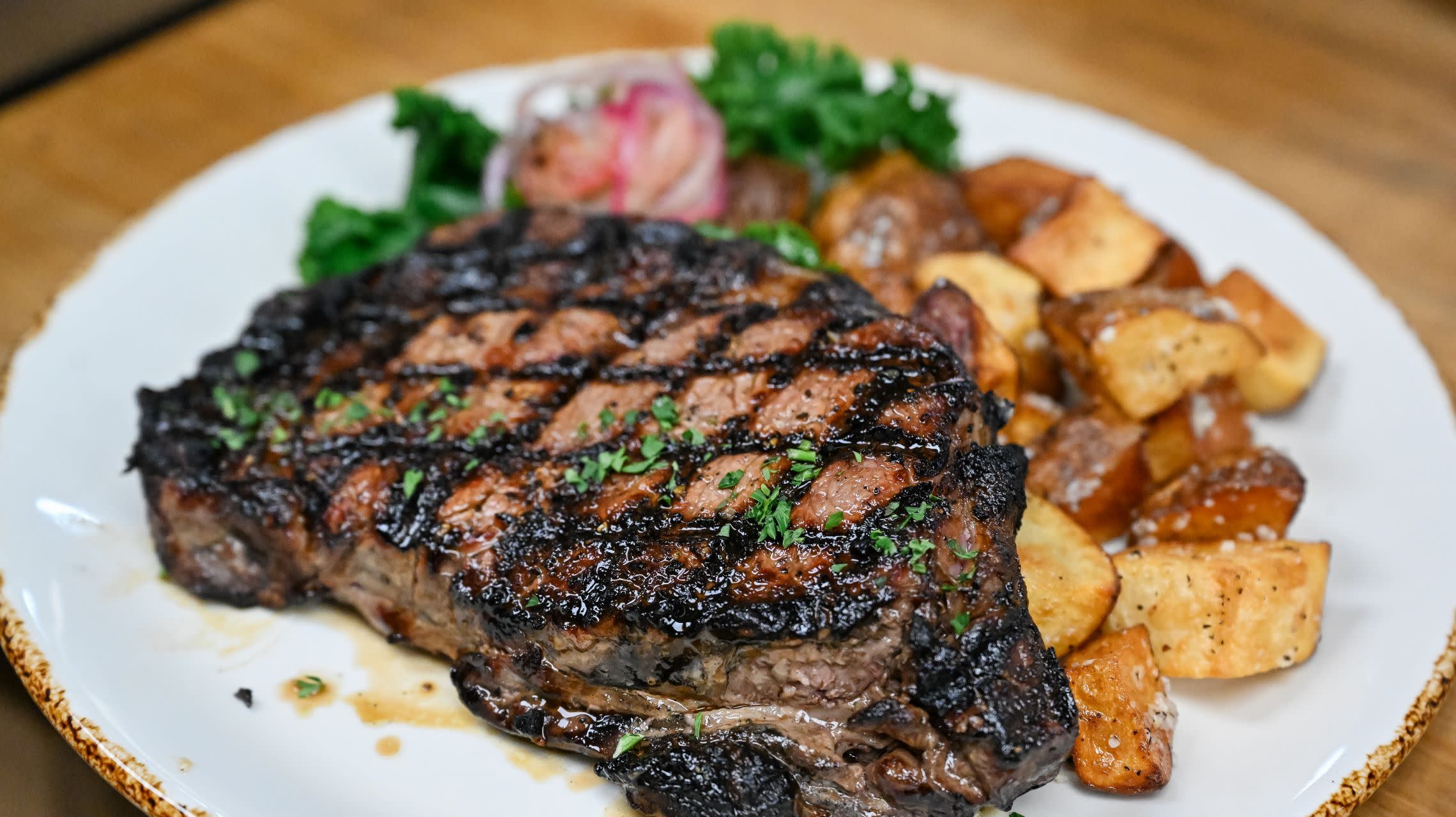 grilled steak and potatoes on a plate
