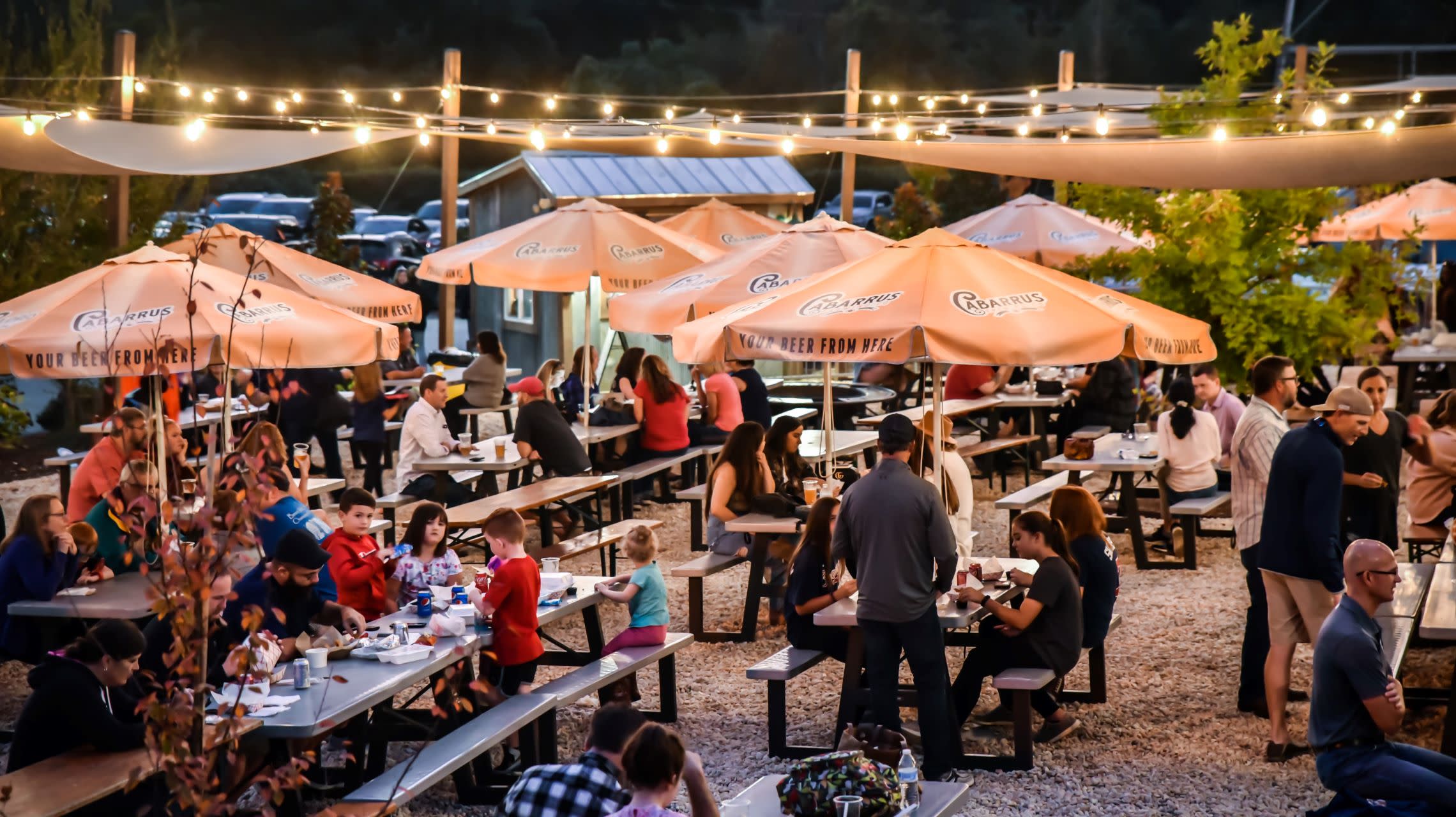 people at tables in beer garden