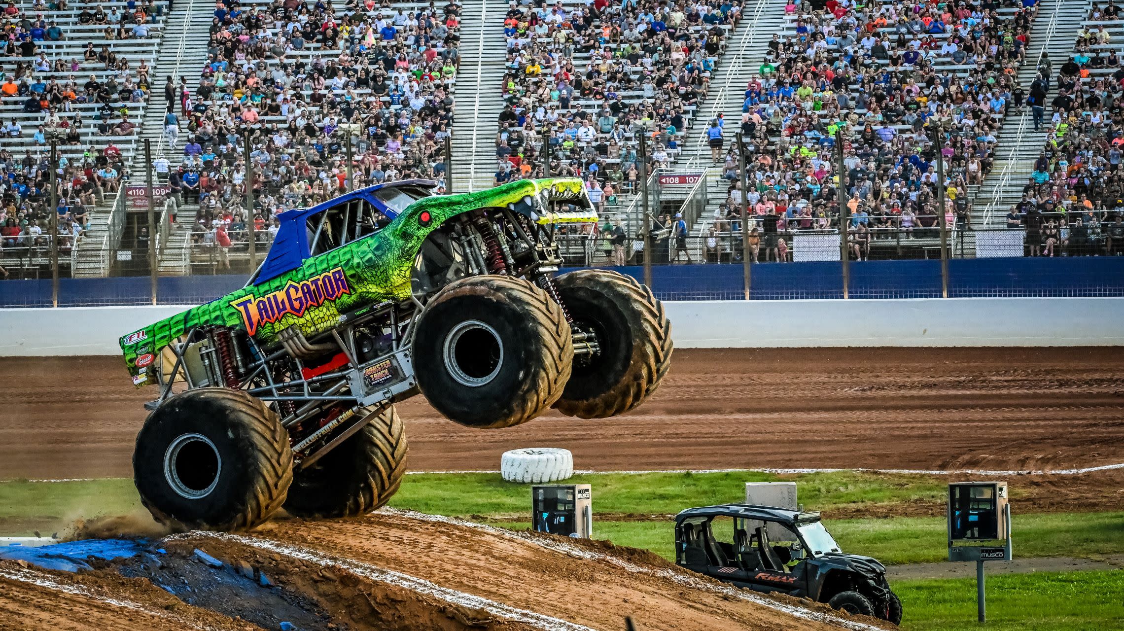 monster truck jumps obstacle