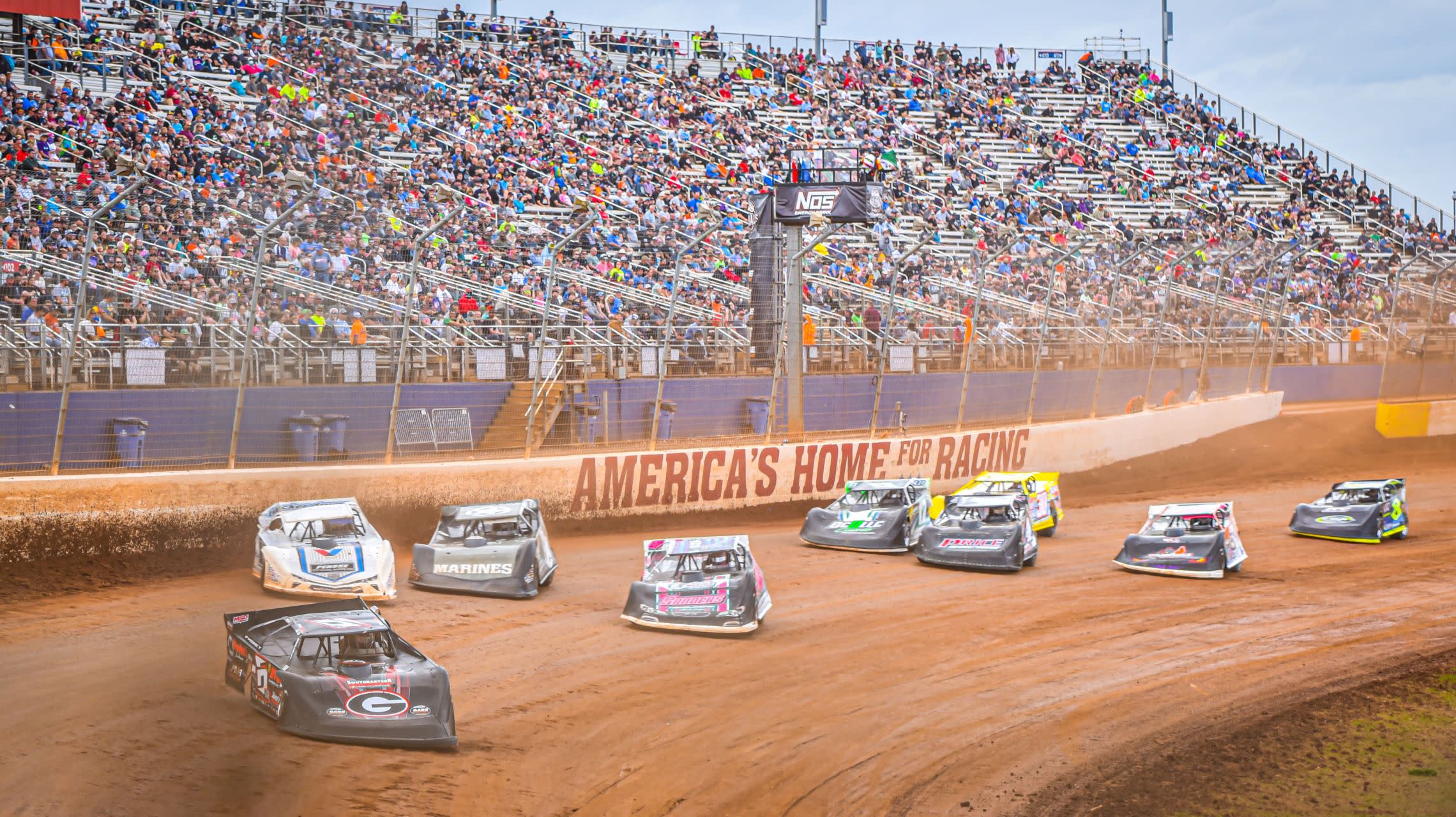 race cars on dirt track