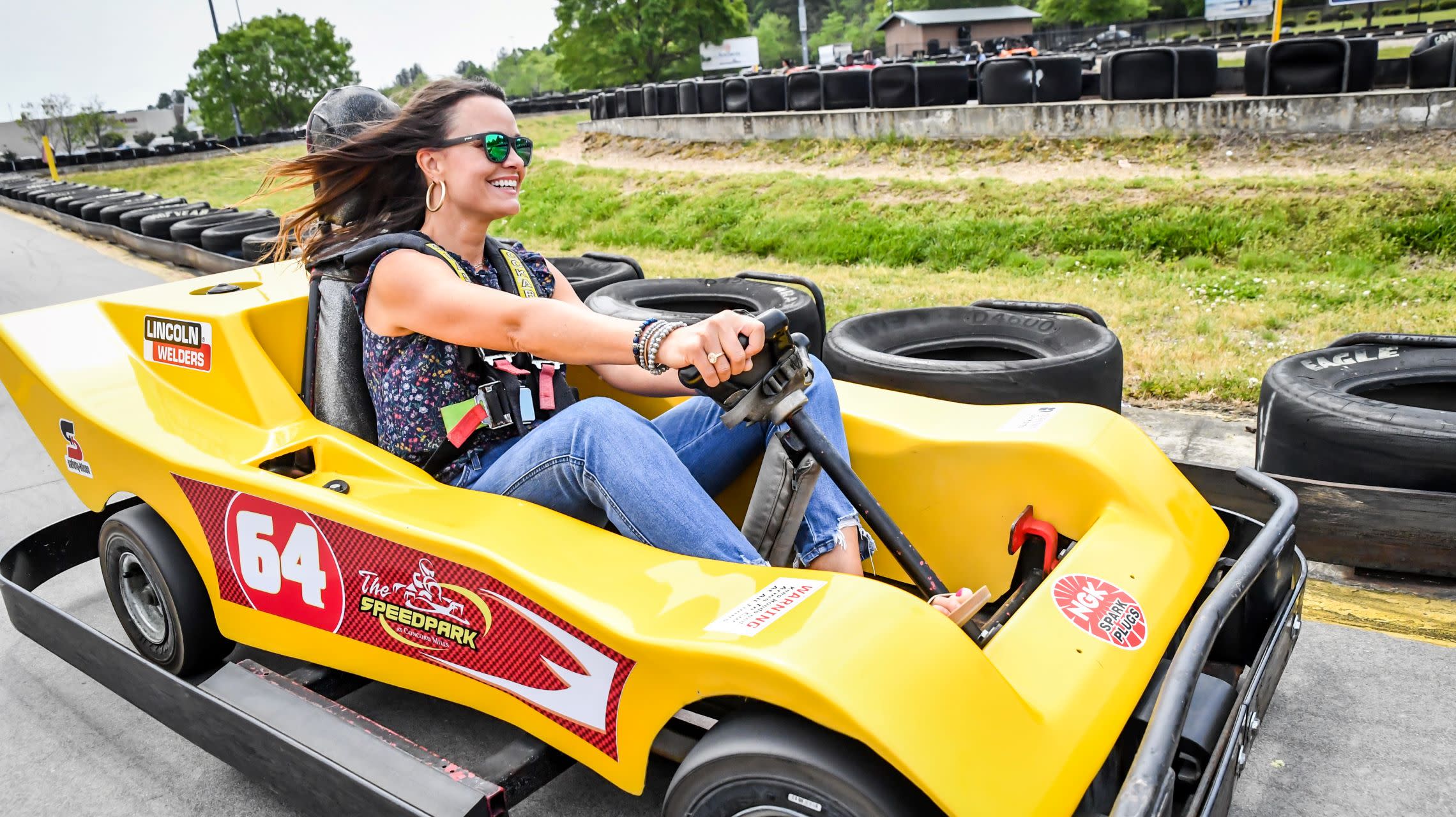 woman driving go kart